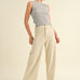 Model is wearing Wild Honey straight wide leg denim pants in beige with high-rise fit
