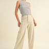 Model is wearing Wild Honey straight wide leg denim pants in beige with high-rise fit