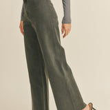 Angled front view of Wild Honey straight wide leg denim pants in washed black