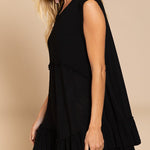 Side view of Wildest Rose tunic dress in black with sleeveless design