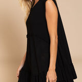 Side view of Wildest Rose tunic dress in black with sleeveless design