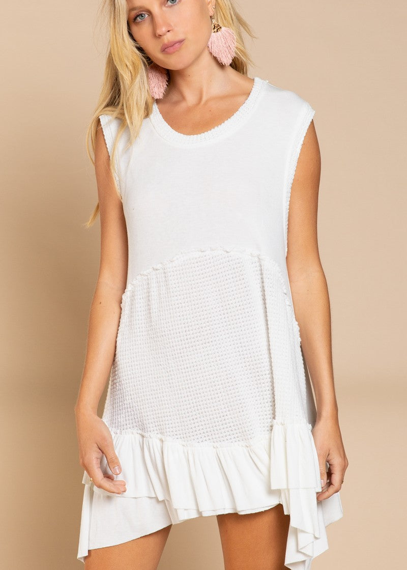 Angled front view of Wildest Rose off white tunic dress with flowy fit