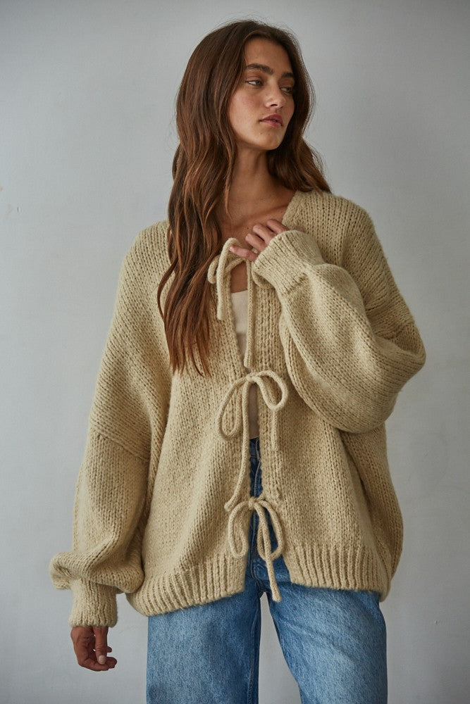 Woman modeling the Willow Boho Tie Cardigan (Sadie Tie Front Cardigan) in light taupe — boho knit cardigan styled for everyday wear.