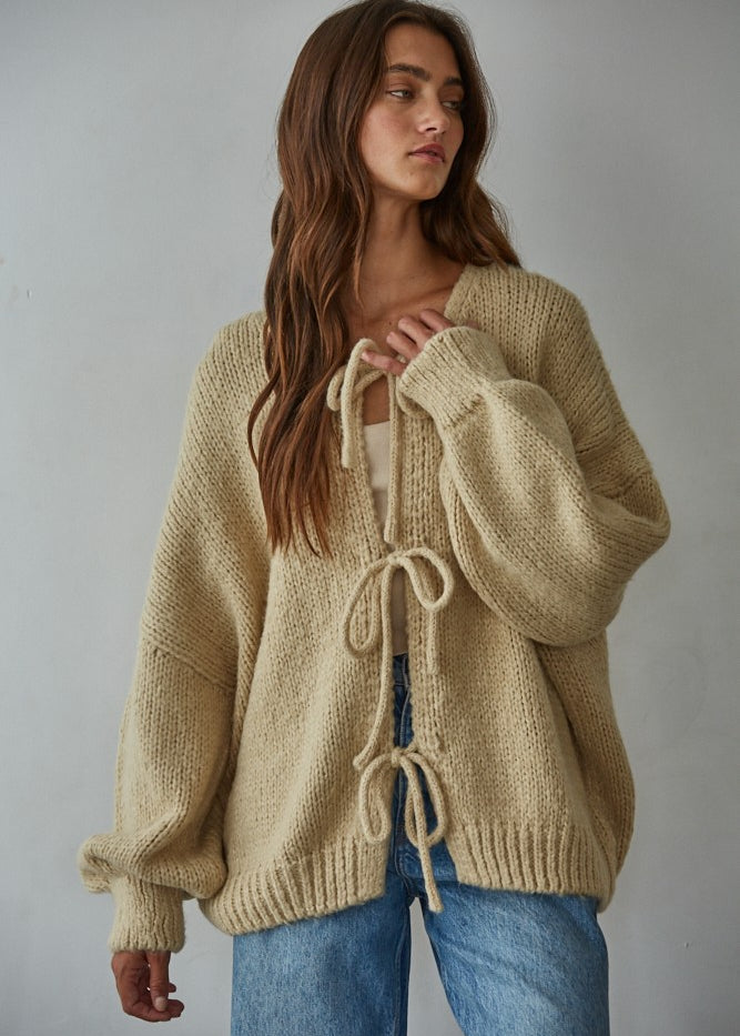 Woman modeling the Willow Boho Tie Cardigan (Sadie Tie Front Cardigan) in light taupe — boho knit cardigan styled for everyday wear.