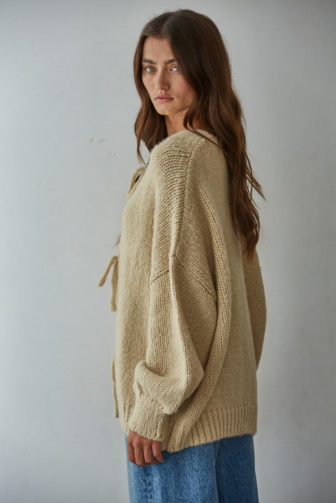 Side view of the Willow Boho Tie Cardigan (Sadie Tie Front Cardigan) in light taupe — relaxed oversized fit with long sleeves.
