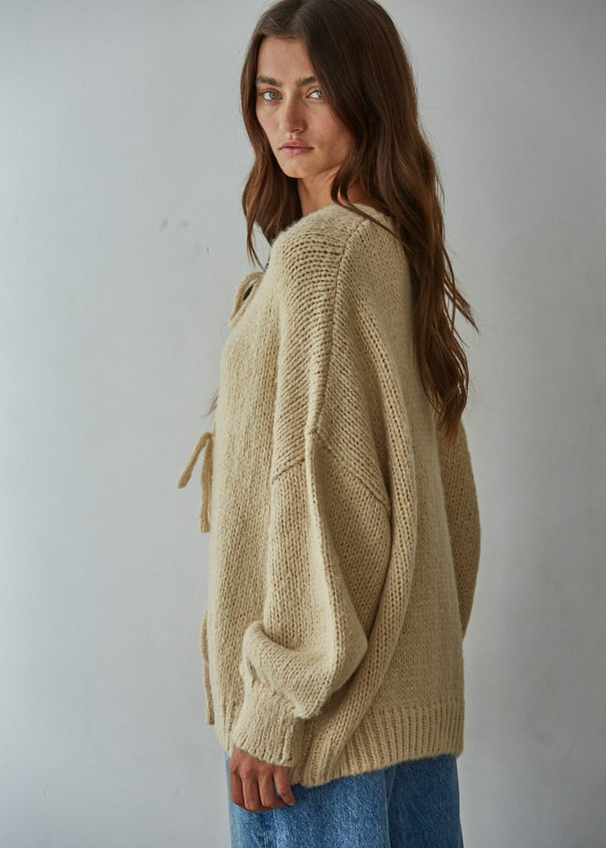Side view of the Willow Boho Tie Cardigan (Sadie Tie Front Cardigan) in light taupe — relaxed oversized fit with long sleeves.