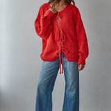 woman is wearing  the Willow Boho Tie Cardigan (Sadie Tie Front Cardigan) in red — relaxed oversized fit and lightweight knit texture